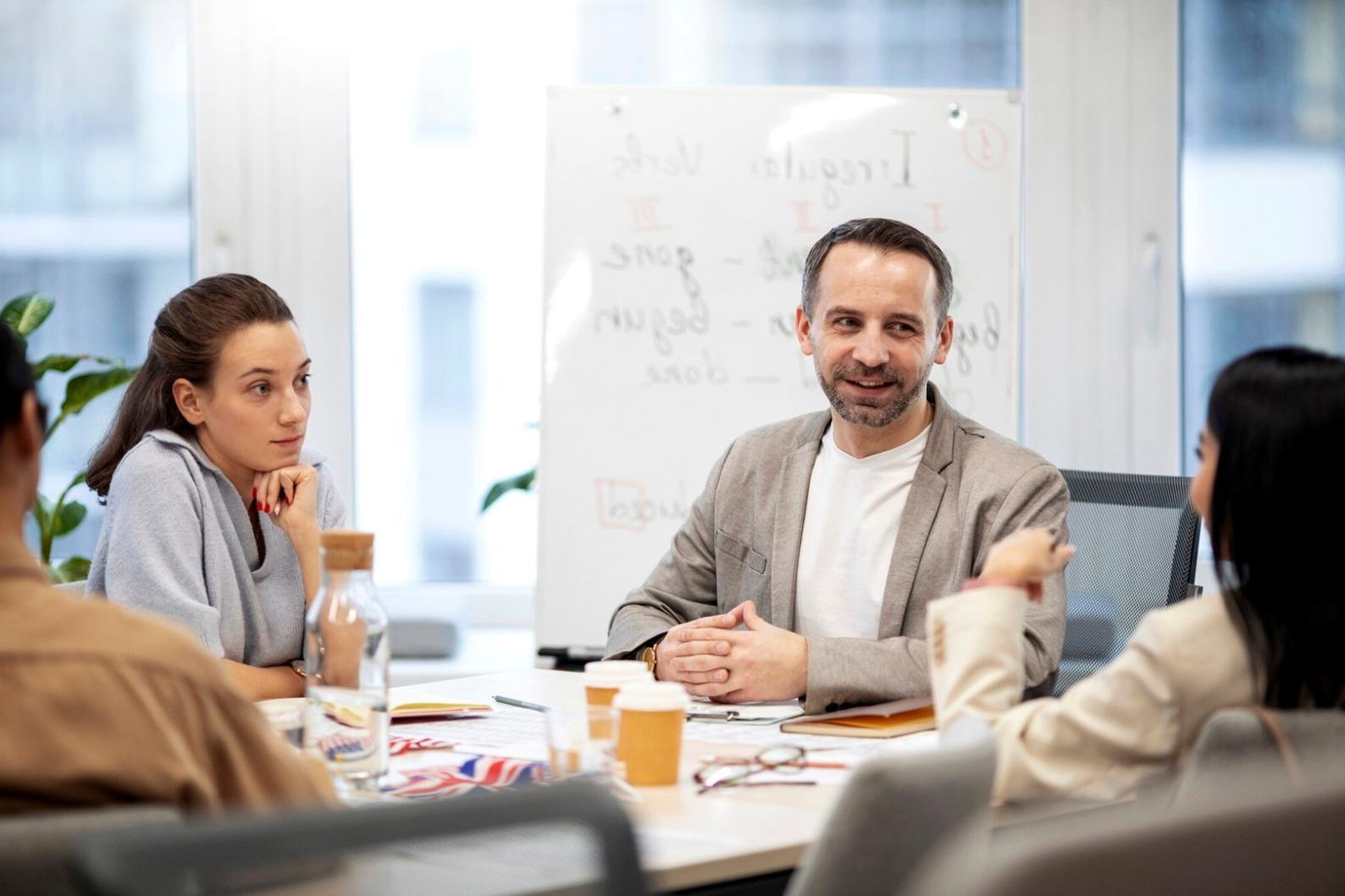 Team meeting discussing community engagement strategies